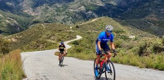 NRG Performance Training athlete climbing a moderate hill during a bicycle ride in Andalucia, Spain
