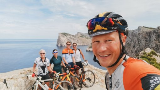 HC Bike Tours founder Aigars Paegle with guests at Formentor lighthouse (Cap Formentor), Mallorca, Spain