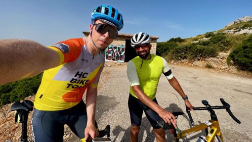 HC Bike Tours ride leader Artis Kalveits with private ride guest during a ride to Albercutx Watchtower (Talaia d'Albercutx) in Mallorca, Spain
