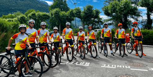 Cyclists getting ready to ride near lake Annecy in France during family bike trip from Annecy to Montreux