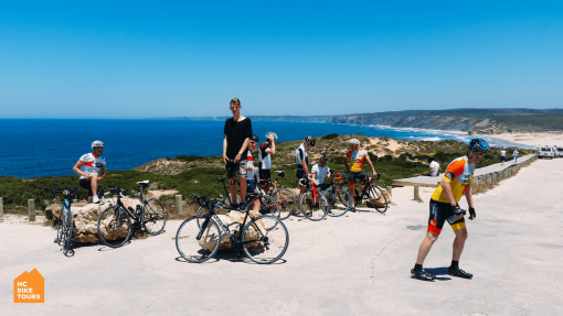Cyclists posing for a picture with the ocean in the back ground during Portugal bike trip 2016