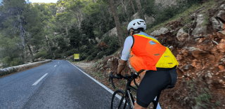 Cyclist climbing Coll de Sabatalla during private guided ride in Mallorca