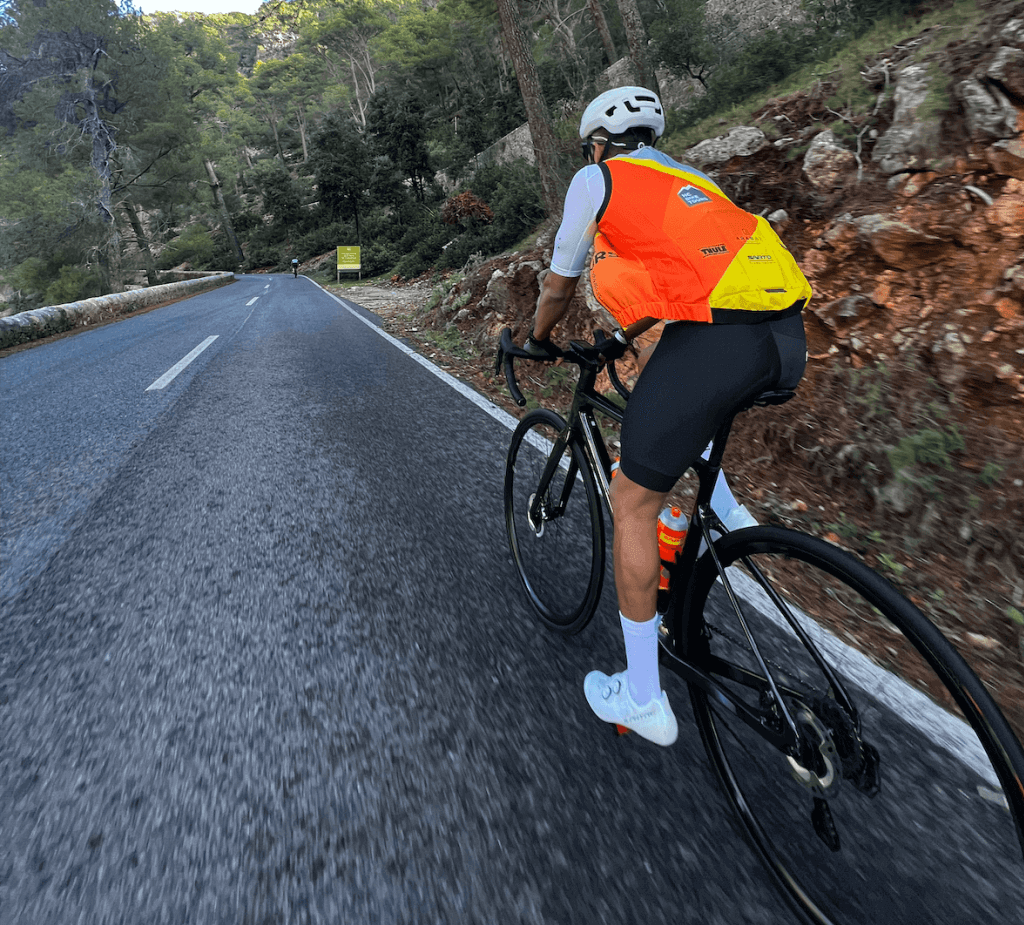 Cyclist climbing Coll de Sabatalla during private guided ride in Mallorca