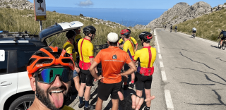 Cyclists regrouping at the top of Coll dels Reis after climbing from Sa Colobra in Mallorca, HC Bike Tours