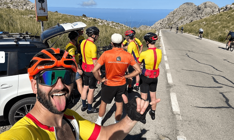 Cyclists regrouping at the top of Coll dels Reis after climbing from Sa Colobra in Mallorca, HC Bike Tours