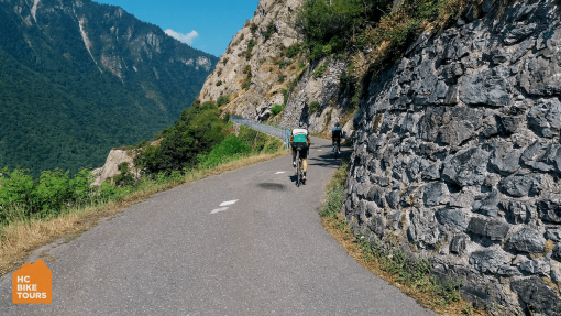 Cyclists climbing Lacets du Montvernier during Tour de France race viewing tour in French Alps