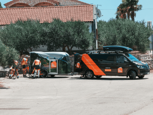 Cyclists regrouping at HC Bike Tours support vehicle during bike trip in Slovenia and Austria