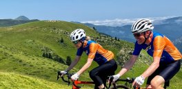 Couple riding in French Pyrenees during a bike trip in July 2023