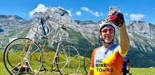 HC Bike Tours guest taking a selfie photo at the Col d'Aubisque during French Pyrenees bike trip in July 2023