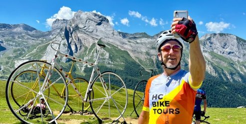 HC Bike Tours guest taking a selfie photo at the Col d'Aubisque during French Pyrenees bike trip in July 2023