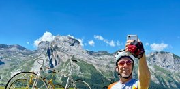 HC Bike Tours guest taking a selfie photo at the Col d'Aubisque during French Pyrenees bike trip in July 2023