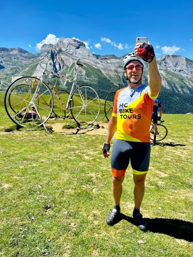 HC Bike Tours guest taking a selfie photo at the Col d'Aubisque during French Pyrenees bike trip in July 2023