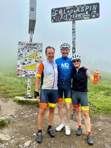 Friends posing for a picture at Col d'Aspin during a bike trip in French Pyrenees in July 2023