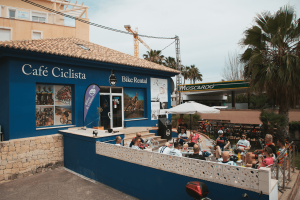 Cyclists enjoying coffee brake during NRG PT Europe cycling camp in Javea, Spain
