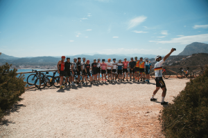 Cyclists posing for a group photo during NRG PT cycling camp in Javea, Spain