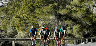 Group of cyclists climbing Coll de Femenia during SAG supported ride to Sa Colobra in Mallorca