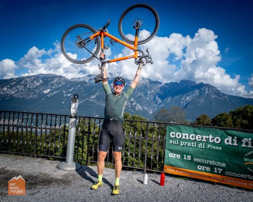Cyclists celebrating another climb successfully conquered during Lake Como bike trip in Italy