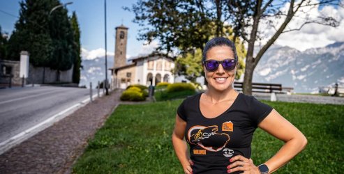 HC Bike Tours service manager Helena, smiling in the sunshine on top of Madonna del Ghisalo during Lake Como bike trip in Italy