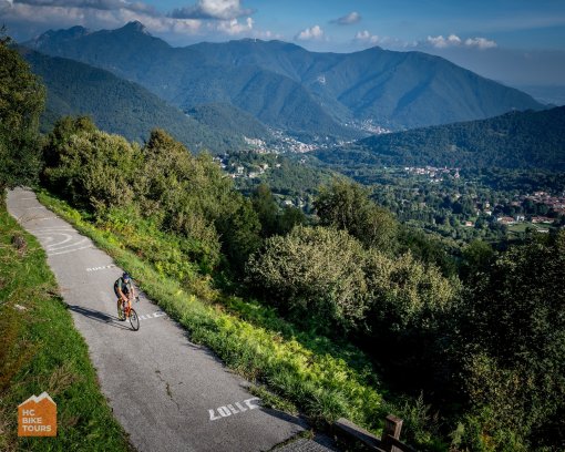 Cyclist climbing the challenging Muro di Sormano climb in Lake Como area in Italy
