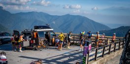 Cyclists enjoying a rest stop with a view during Lake Como bike trip in Italy