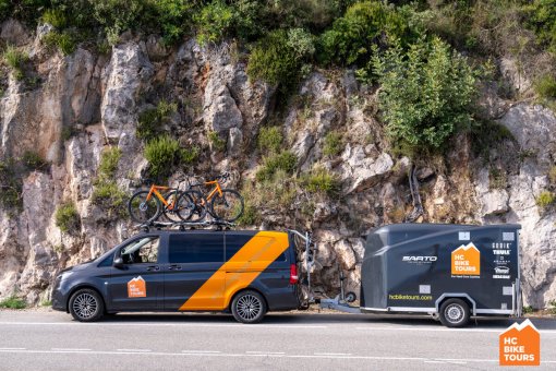 "HC Bike Tour van and trailer, with bikes ready to start the tour in the mountains.