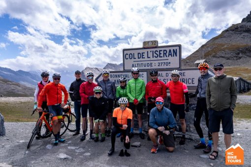 HCBike Tours cyclists posing in front of the sign Col de L'iseran