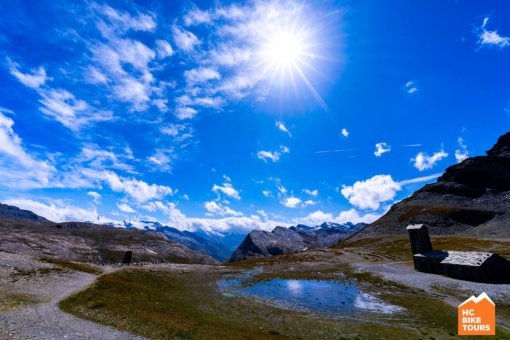 Sun is shining brightly in the blue sky over the French Alps