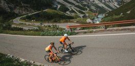 HC Bike Tours climbing by bike Passo Stelvio mountain in Italy