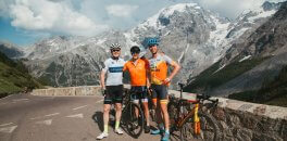 HC Bike Tours Ride Leader with guests at the infamous cycling climb Passo dello Stelvio in Italy