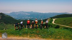 HC Bike Tours organized bike tour in Cantabria Spain | A group of our guests at the top of Lagos de Covadonga climb